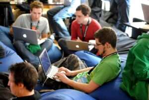 A group of techies doing work wearing woven lanyards, woven lanyards are perfect for any high-visibility occasion